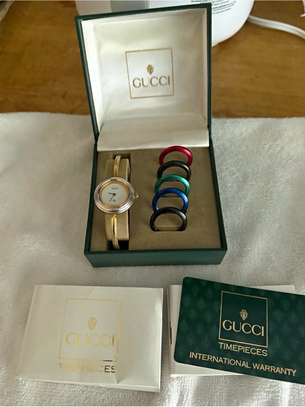 Gucci Gold-Tone Bangle Watch with Interchangeable Colored Bezels